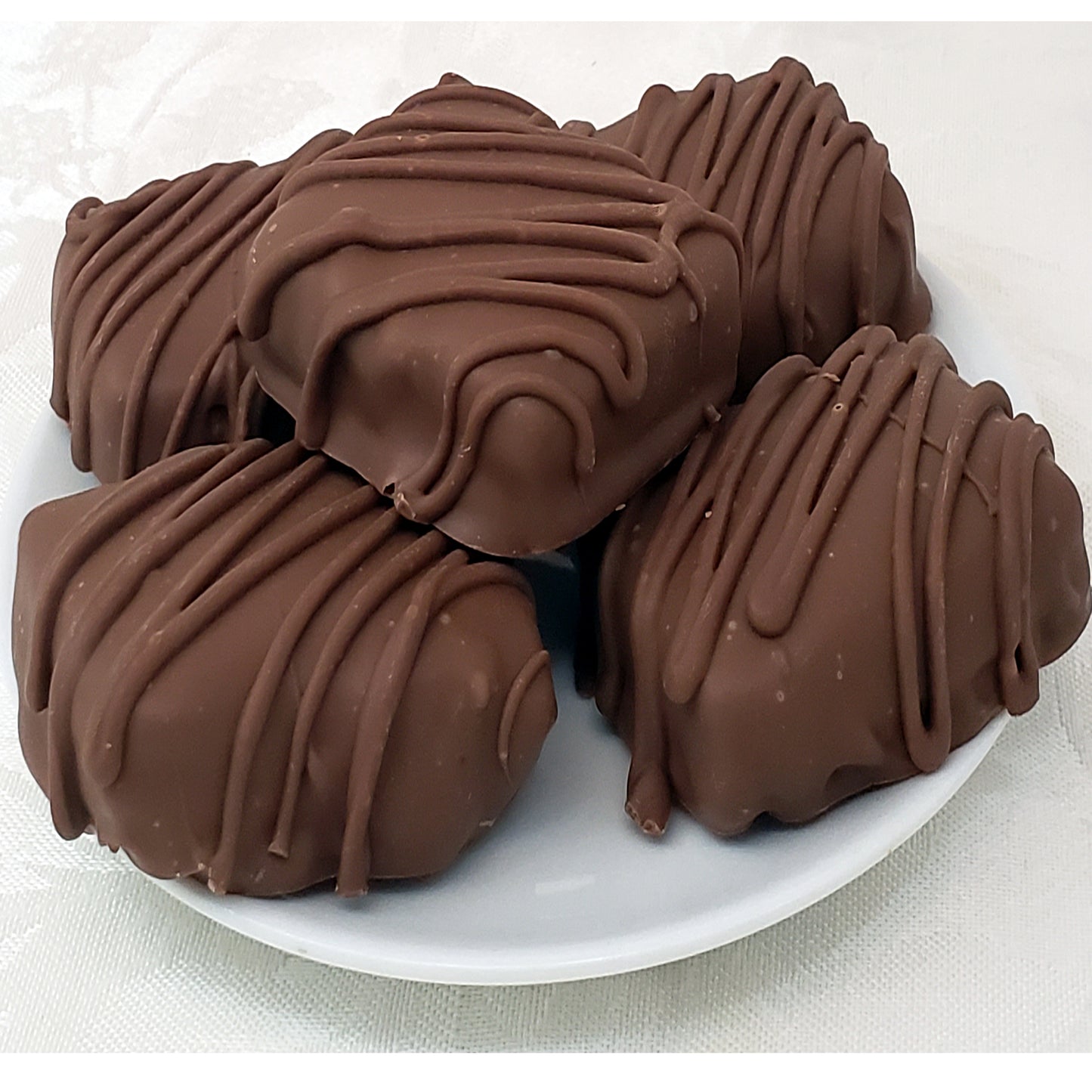 Chocolate Covered Fruitcake Slices in a Snowman Tin