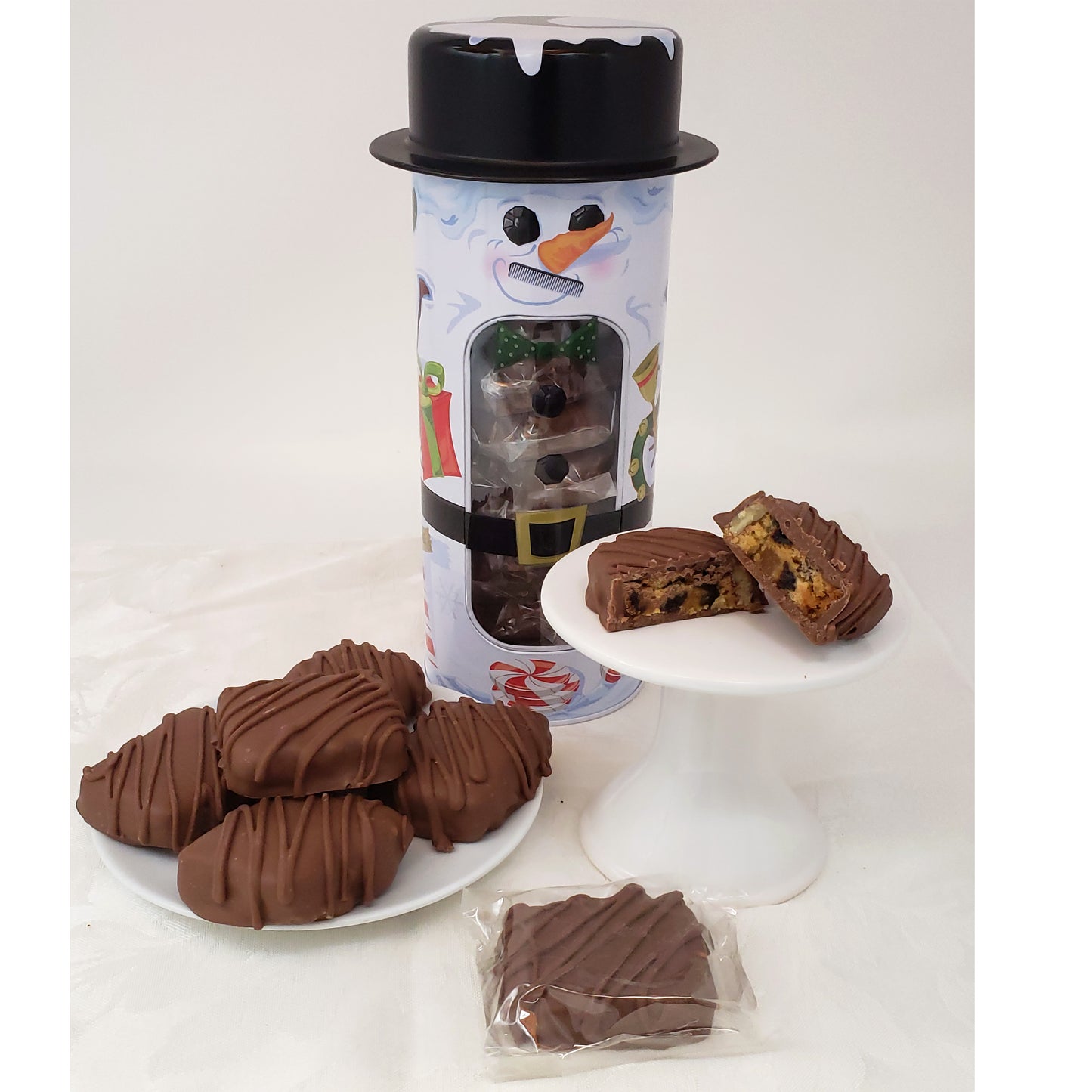 Chocolate Covered Fruitcake Slices in a Snowman Tin